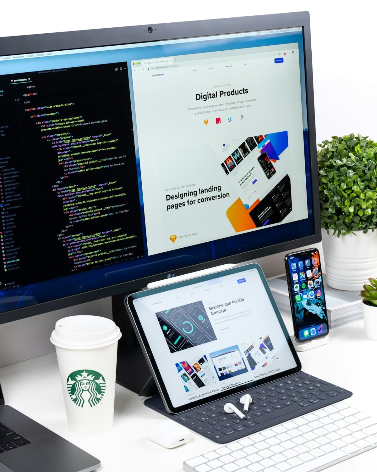 Website designs shown on a desk display